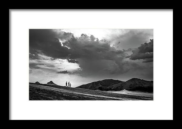 Black Framed Print featuring the photograph The family - Romania - Black and white street photography by Giuseppe Milo