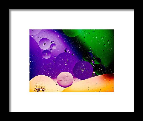 Oil And Water Image Macro Closeup Purple Green Space Framed Print featuring the photograph The far Side Moons by Bruce Pritchett