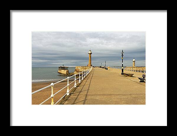 Britain Framed Print featuring the photograph The West Pier and Breakwater - Whitby by Rod Johnson