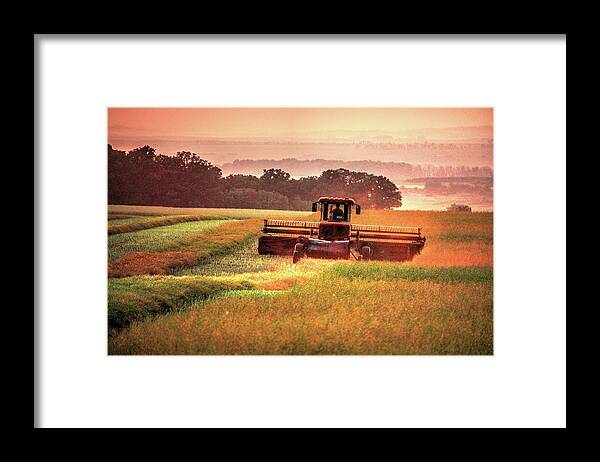 Threshing Fields Sunflowers Sunsets Smoke Smote Haze Sun Haze Moods Harvest Fall Reaping Farming Crops Wheat Days End Combine Moon Framed Print featuring the photograph Swathing on the hill by David Matthews