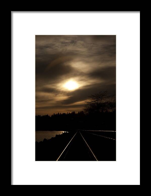 Tracks Framed Print featuring the photograph Tracking the Sun by Monte Arnold