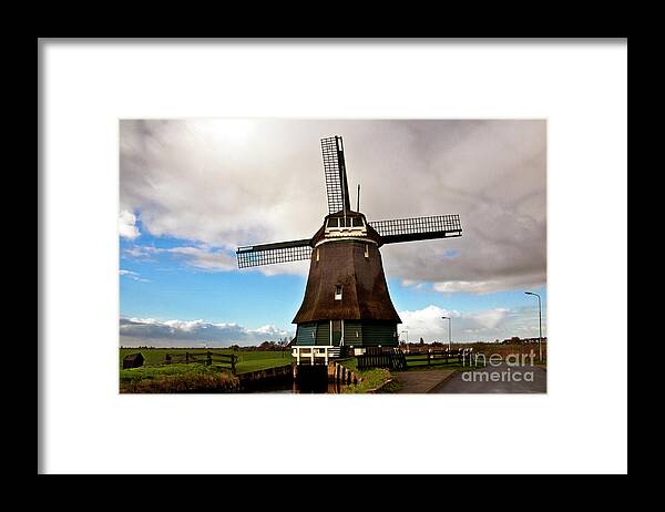 Traditional Dutch Windmill Framed Print featuring the photograph Traditional Dutch Windmill near Volendam by Silva Wischeropp