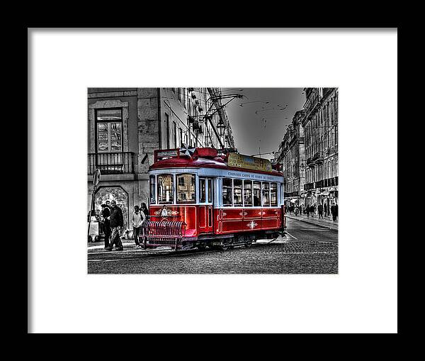 Tram Framed Print featuring the photograph Traditional Red tram in Lisbon by Aleksandra B