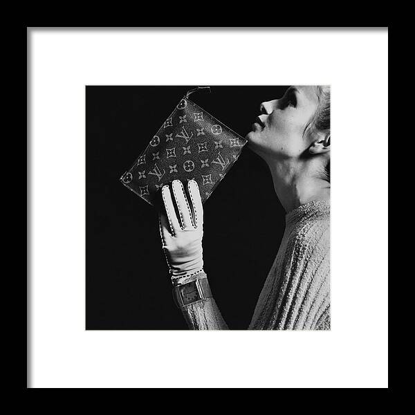 Twiggy Holding Louis Vuitton Envelope Bag by Bert Stern