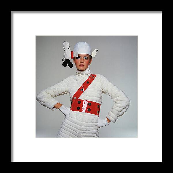 Twiggy Framed Print featuring the photograph Twiggy Wearing Snoopy Hat by Bert Stern
