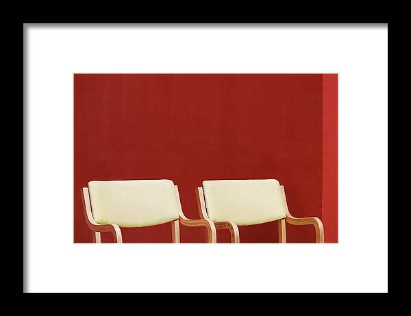Plain Red Wall Framed Print featuring the photograph Two Yellow Chairs Minimalism by Prakash Ghai