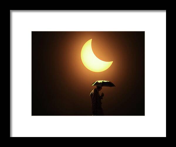 Sun Framed Print featuring the photograph Umbrella Man Eclipse by Christopher McKenzie