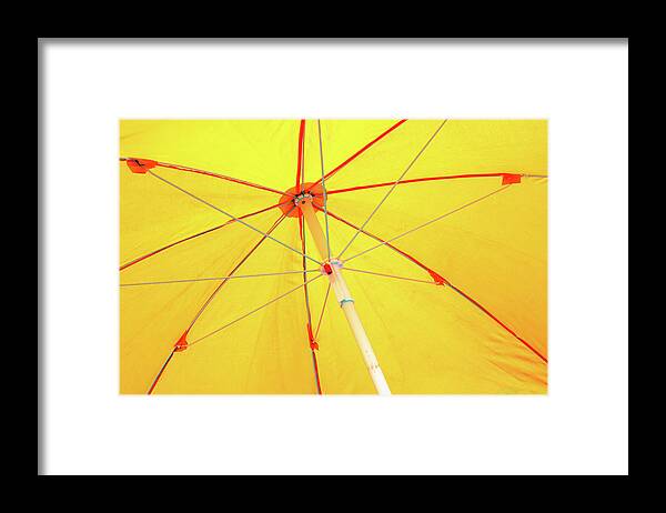 Minimalism Framed Print featuring the photograph Underneath the Yellow Umbrella by Prakash Ghai