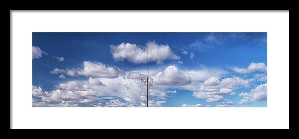 Surrealistic Skies Framed Print featuring the photograph View of a Phone Pole by Gary Warnimont