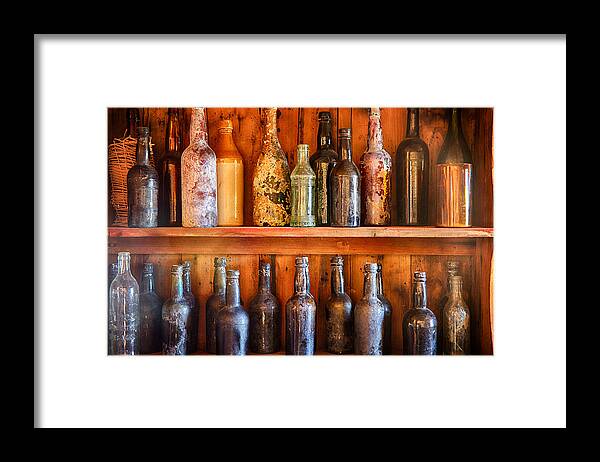 Vintage Liquor Bottles Framed Print featuring the photograph Vintage Liquor Bottles on a Shelf by Saija Lehtonen