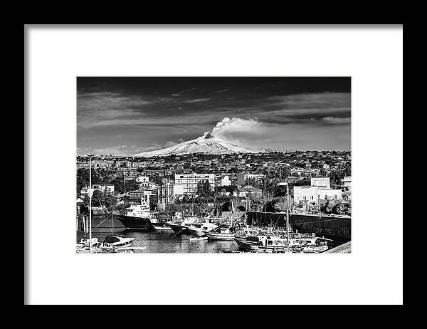 Volcano Framed Print featuring the photograph Volcano Etna seen from Catania - Sicily. by Mirko Chessari