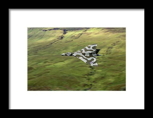 Avro Vulcan Framed Print featuring the photograph Vulcan B2 low-level against hillside by Gary Eason