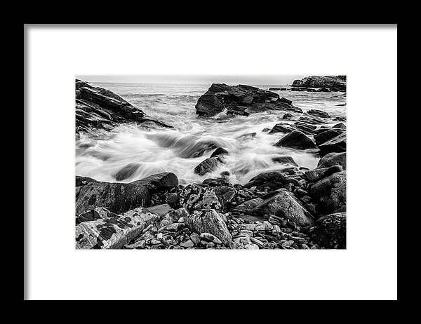 Black And White Framed Print featuring the photograph Waves Against a Rocky Shore in BW by Doug Camara