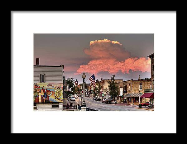 Stoughton Wi Wisconsin Norwegian Dancers Cumulonimbus Rain Storm Main Street Hwy 51 Yahara River Framed Print featuring the photograph Welcome to Stoughton - heritage mural and main street with cumulonimbus stormcloud in background by Peter Herman