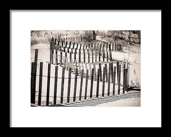 Beach Fence Framed Print featuring the photograph Winding Beach Fences in Sepia by Colleen Kammerer