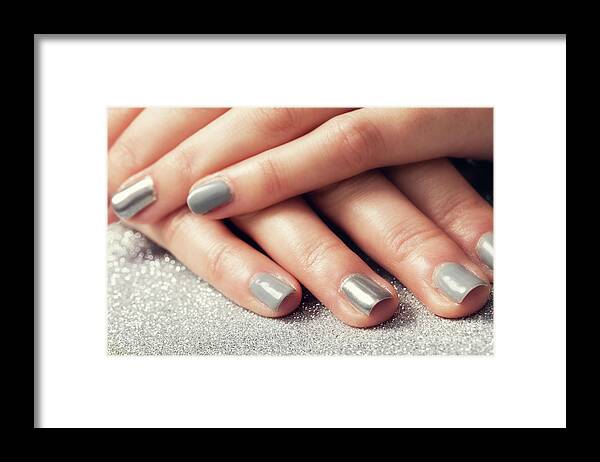 Nail Framed Print featuring the photograph Woman's nails with shiny silver hybrid manicure by Michal Bednarek