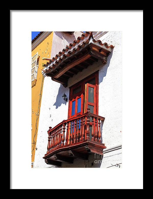 Wood Balcony In Cartagena Framed Print featuring the photograph Wood Balcony in Cartagena by John Rizzuto