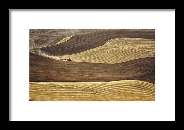 Palouse Framed Print featuring the photograph Working the fields in Palouse by Eduard Moldoveanu