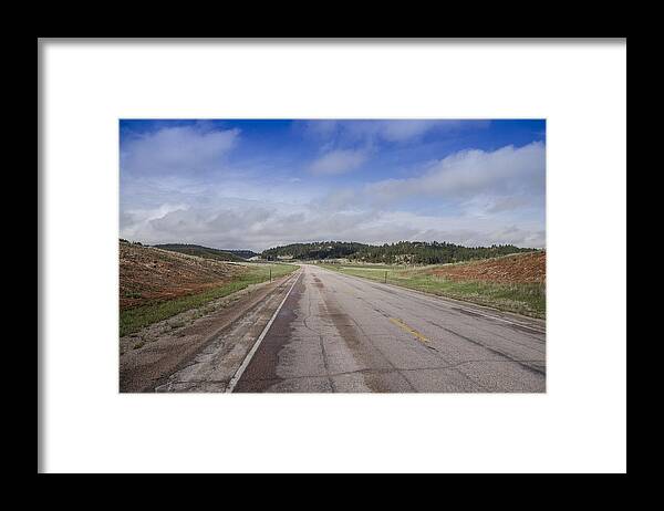 Road Framed Print featuring the photograph Wyoming Road by Erik Burg