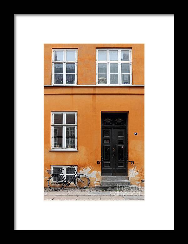 Copenhagen Denmark Yellow House Bike Orange Framed Print featuring the photograph The Orange House Copenhagen Denmark by Julia Gavin