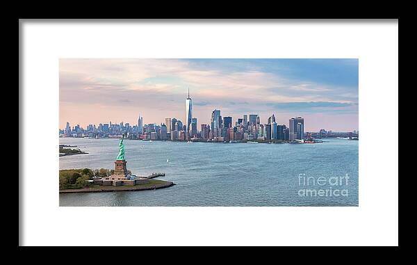 Statue Of Liberty Framed Print featuring the photograph Aerial of the Statue of Liberty and Manhattan skyline, New York, #1 by Matteo Colombo