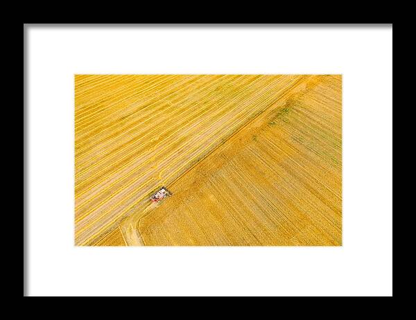 Landscapeaerial Framed Print featuring the photograph Aerial View Combine Harvester Working #1 by Ryhor Bruyeu
