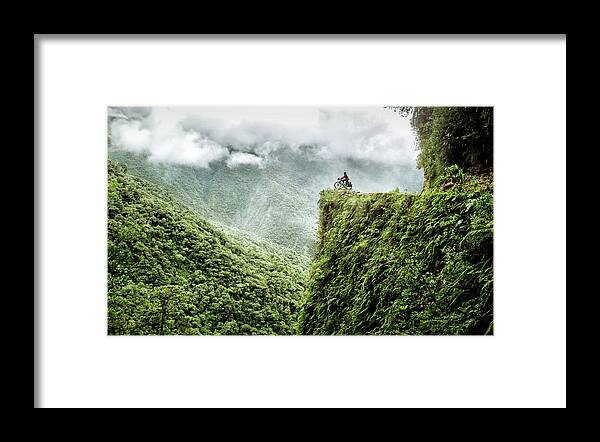 Bolivia Framed Print featuring the photograph Cycling the death road in Bolivia #1 by Kamran Ali