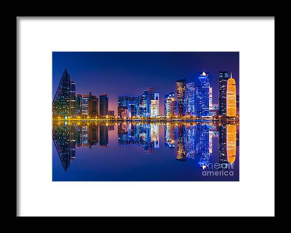 Doha Framed Print featuring the photograph Doha skyline reflection night #1 by Benny Marty