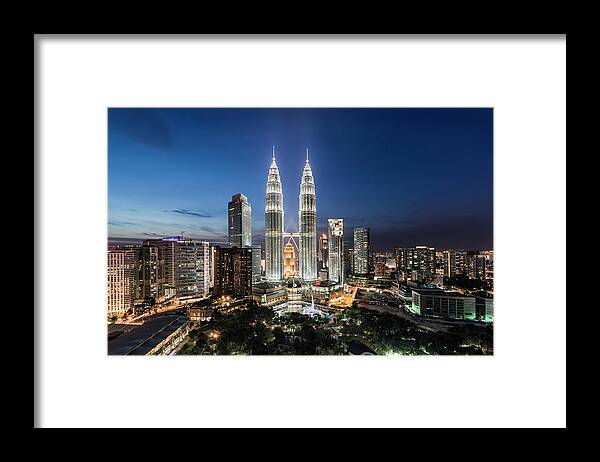 Built Structure Framed Print featuring the photograph Elevated View Of The Petronas Towers At #1 by Martin Puddy