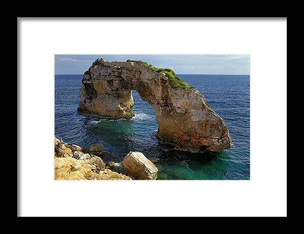 Tranquility Framed Print featuring the photograph Es Pontas, A Natural Rock Arch In The #1 by Cornelia Doerr