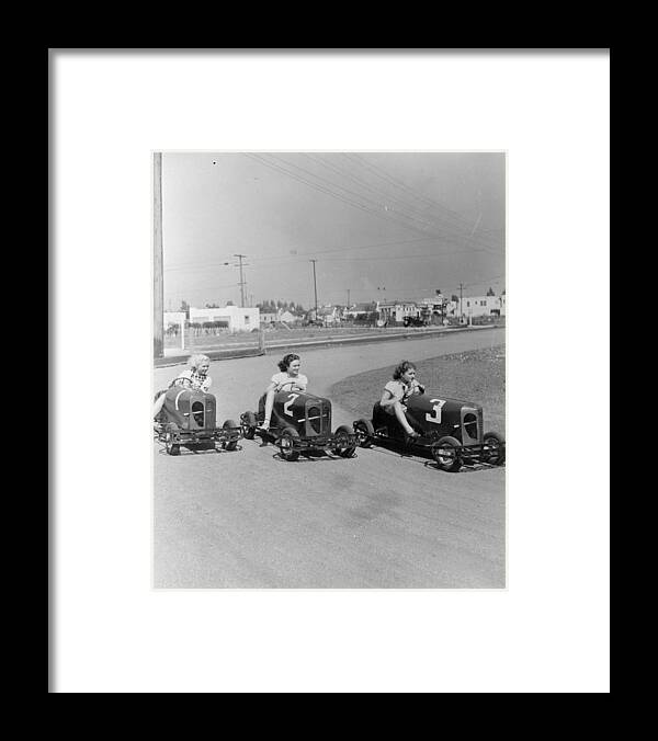 Recreational Pursuit Framed Print featuring the photograph Go Go Cart Girls #1 by General Photographic Agency