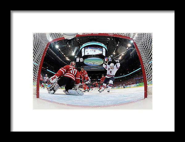 Scoring Framed Print featuring the photograph Ice Hockey - Day 10 - Canada V Usa #1 by Bruce Bennett