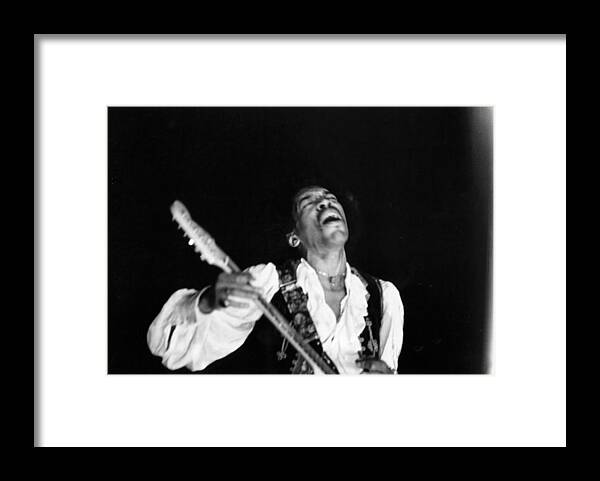Music Framed Print featuring the photograph Jimi Hendrix Performs At Monterey #1 by Michael Ochs Archives