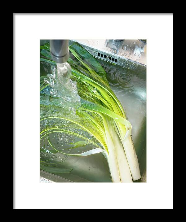 Preparation Framed Print featuring the photograph Laver Les Poireaux Dans L'evier Washing Leeks In The Sink #1 by Studio - Photocuisine