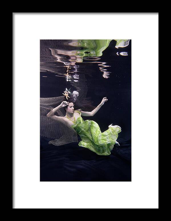 Tranquility Framed Print featuring the photograph Mixed Race Woman In Dress Swimming #1 by Ming H2 Wu