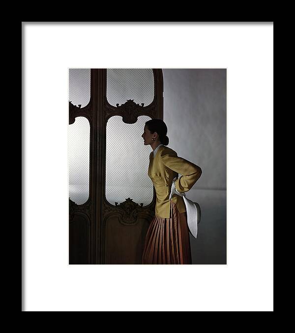 Fashion Framed Print featuring the photograph Model In A Vogue Patterns Ensemble #1 by Horst P. Horst