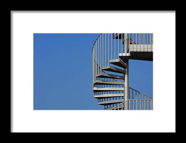 Steps Framed Print featuring the photograph Spiral Staircase Against A Blue Sky #1 by Martin Ruegner