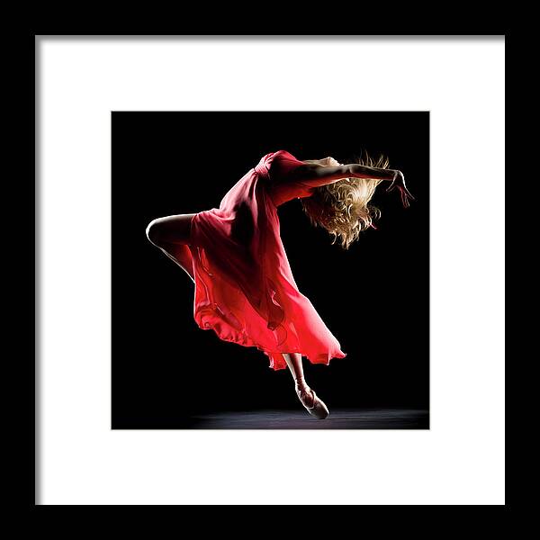 Ballet Dancer Framed Print featuring the photograph The Dancer On Black Background #1 by Proxyminder