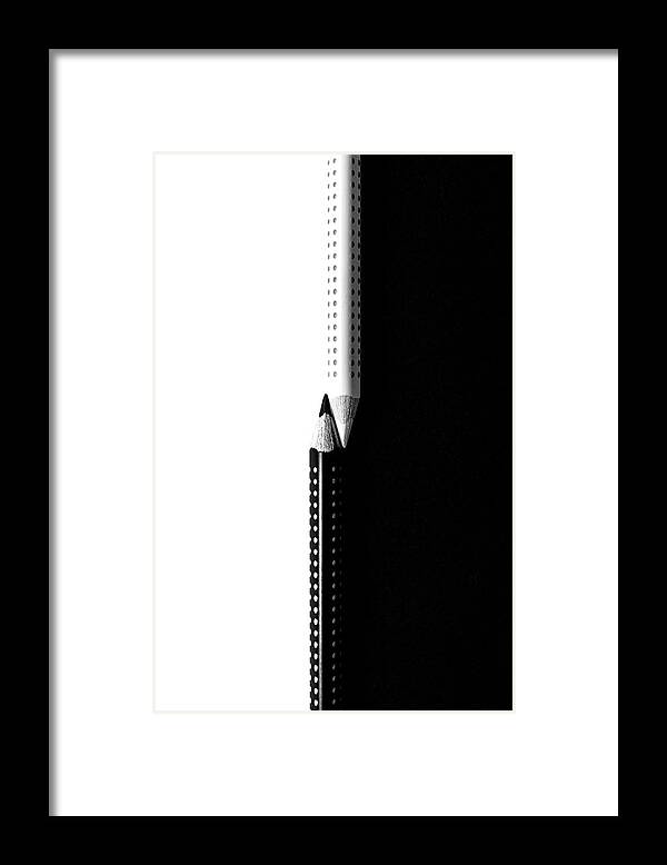 Pencil Framed Print featuring the photograph Two drawing pencils on a black and white surface. by Michalakis Ppalis