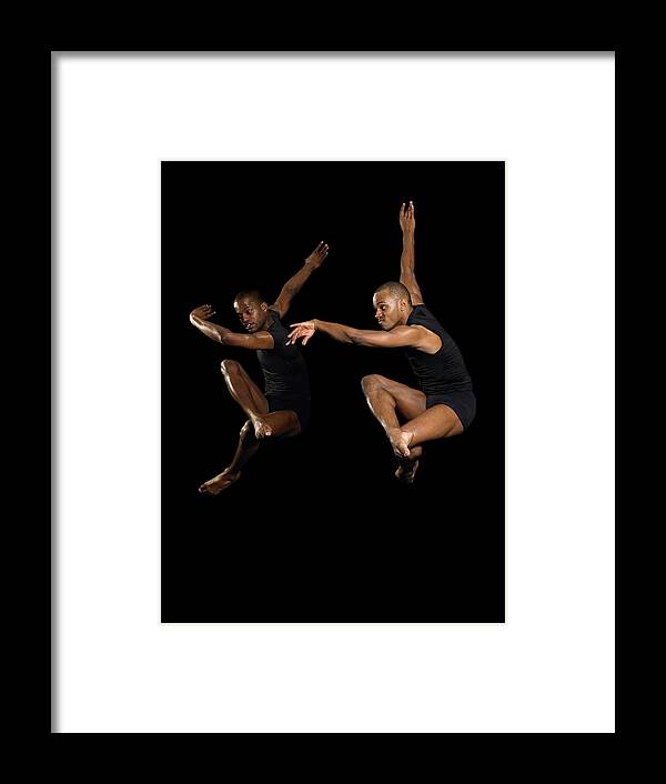 Young Men Framed Print featuring the photograph Two Male Dancers Jumping #1 by Image Source