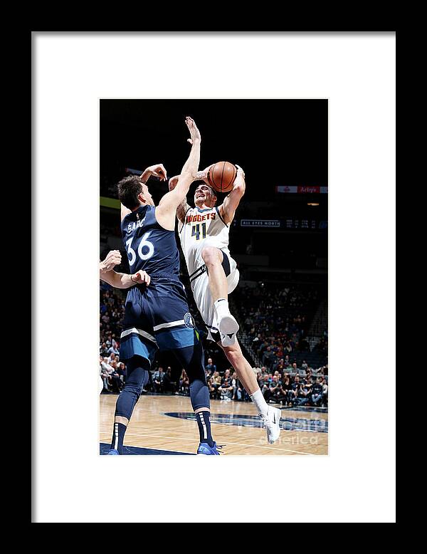 Juan Hernangomez Framed Print featuring the photograph Denver Nuggets V Minnesota Timberwolves by David Sherman