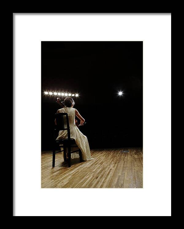 Mature Adult Framed Print featuring the photograph A Female Cellist Playing Cello On #2 by Sot