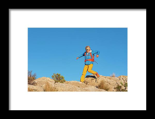 Alicante Framed Print featuring the photograph A Woman Hiking In The High Country, El Divino Mountain, Costa Blanca #3 by Cavan Images
