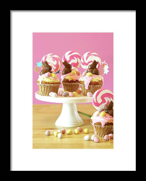 Easter Framed Print featuring the photograph Easter theme candy land drip cupcakes in party table setting. #3 by Milleflore Images