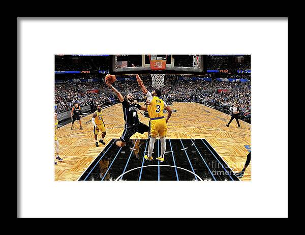 Evan Fournier Framed Print featuring the photograph Los Angeles Lakers V Orlando Magic by Fernando Medina