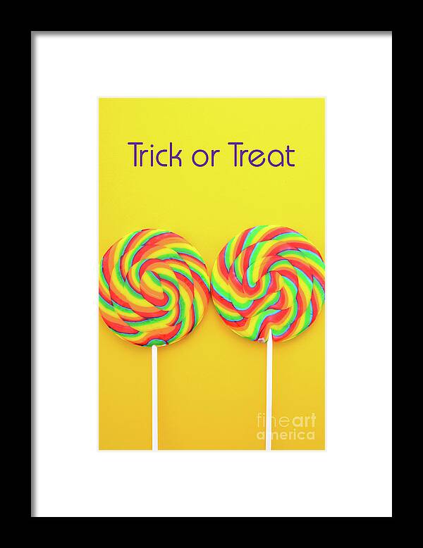 Holiday Framed Print featuring the photograph Rainbow lollipop candy on bright yellow wood table. #3 by Milleflore Images