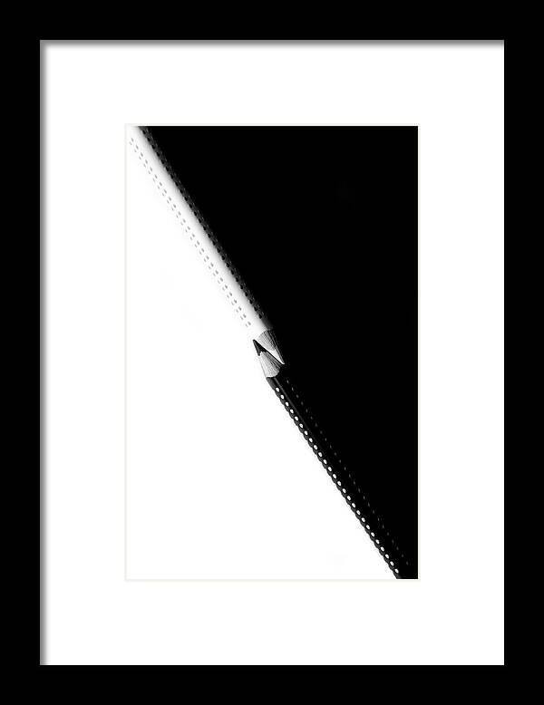Education Framed Print featuring the photograph Two drawing pencils on a black and white surface. by Michalakis Ppalis