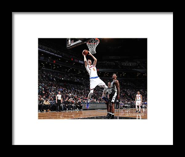 Kristaps Porzingis Framed Print featuring the photograph New York Knicks V Brooklyn Nets #5 by Nathaniel S. Butler