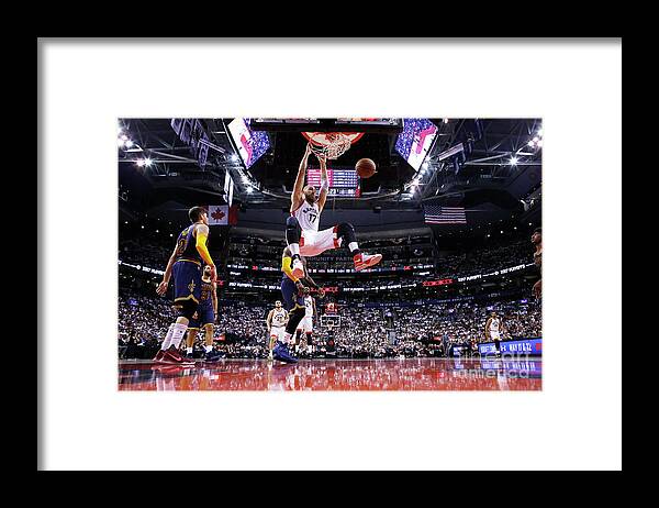 Jonas Valanciunas Framed Print featuring the photograph Cleveland Cavaliers V Toronto Raptors - by Mark Blinch