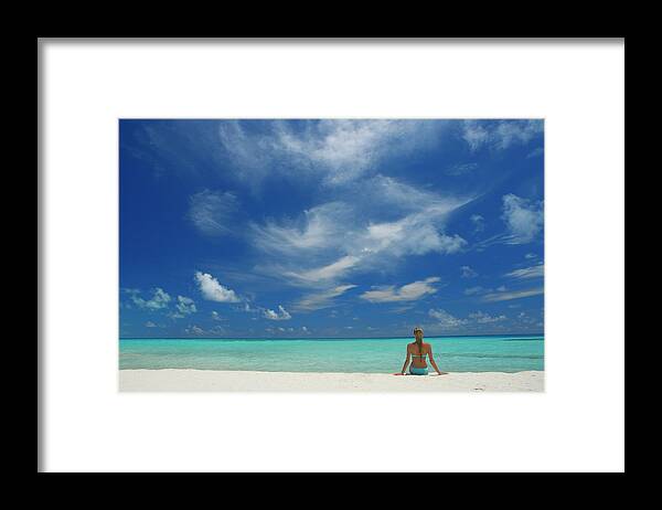 Woman Sitting On The Beach Looking Out To Sea Framed Print featuring the photograph 795-24 by Robert Harding Picture Library